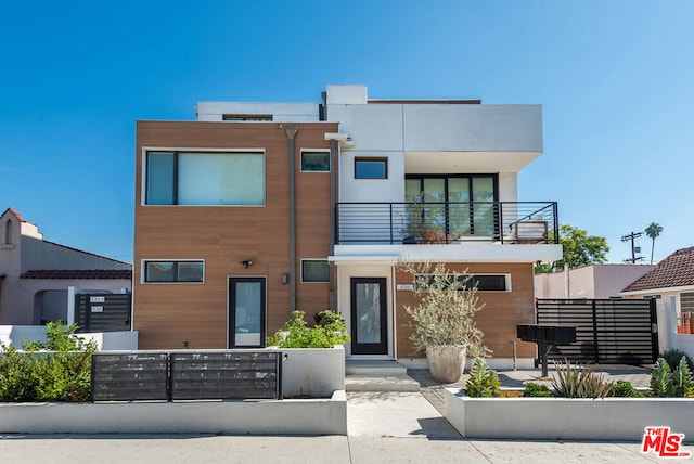 contemporary home with a balcony