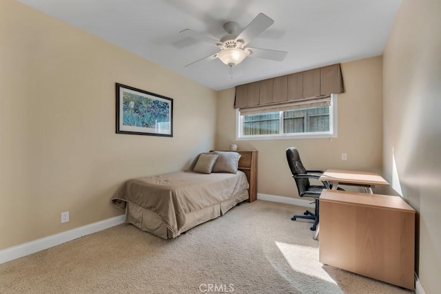 bedroom featuring light carpet and ceiling fan