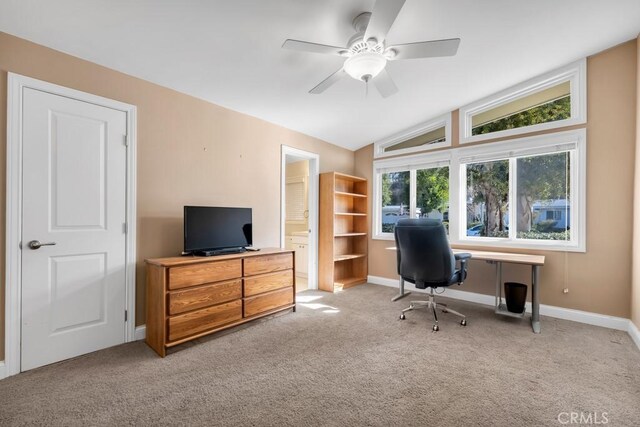 office area featuring lofted ceiling, light colored carpet, and ceiling fan