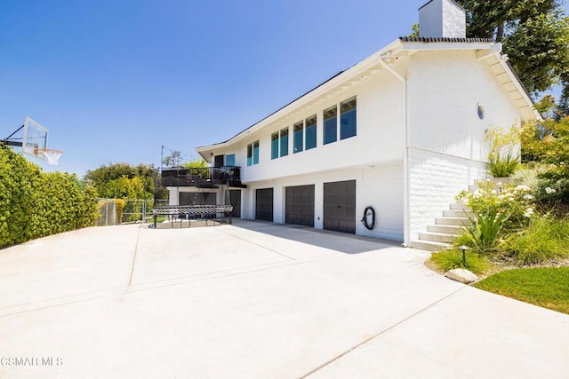 view of side of property featuring a garage