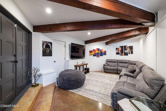 living room featuring concrete flooring and beamed ceiling