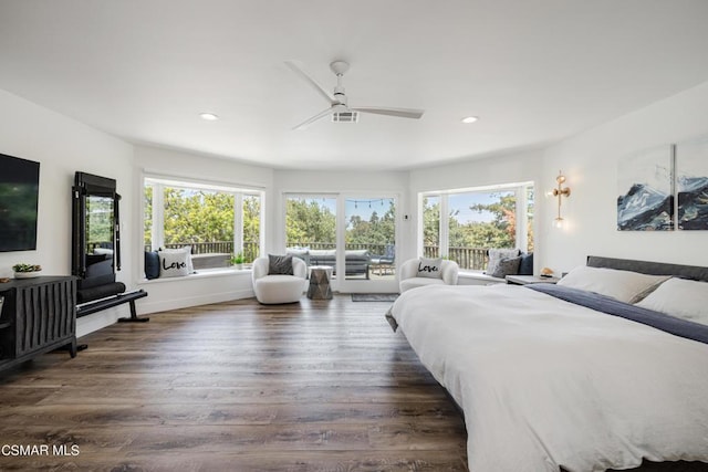 bedroom with ceiling fan, dark hardwood / wood-style floors, multiple windows, and access to outside