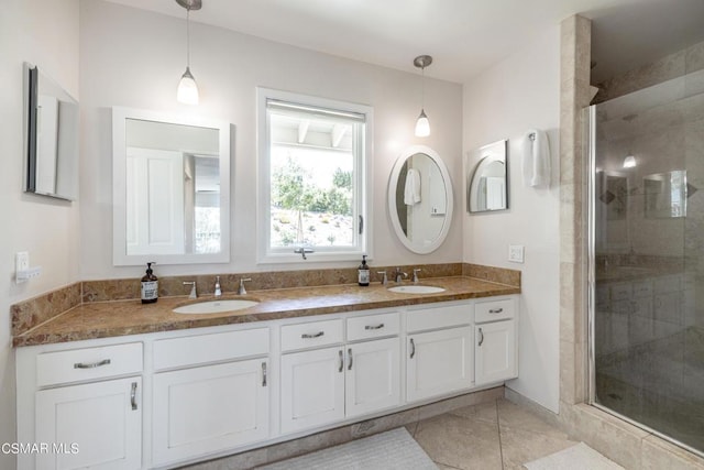 bathroom featuring vanity and an enclosed shower