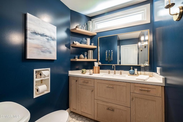 bathroom with vanity and toilet