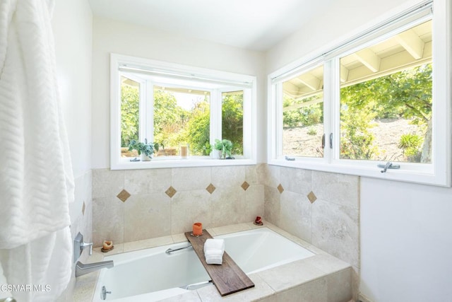 bathroom featuring tiled bath