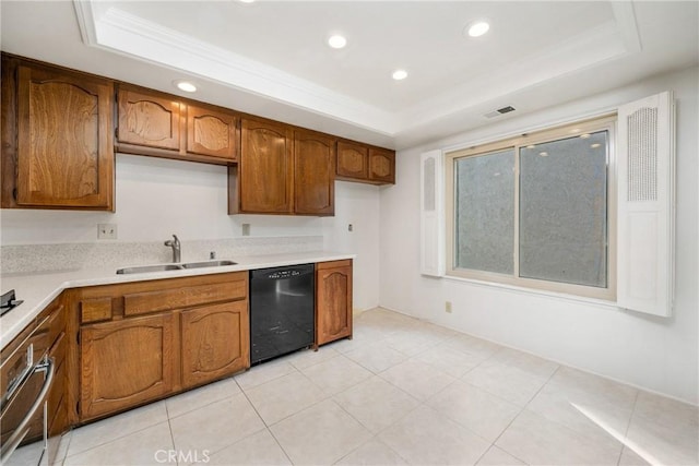 kitchen with sink, ornamental molding, a tray ceiling, dishwasher, and oven