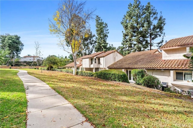 view of side of property featuring a yard