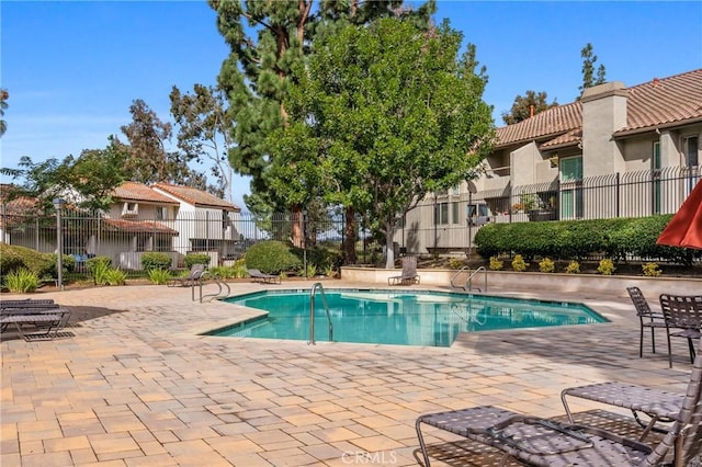 view of pool featuring a patio