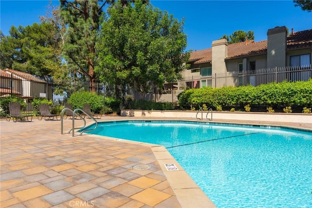 view of swimming pool featuring a patio