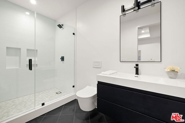 bathroom with tile patterned floors, toilet, an enclosed shower, and vanity