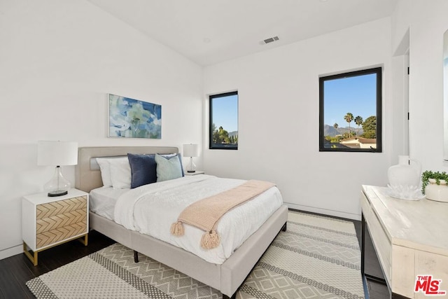 bedroom featuring dark wood-type flooring