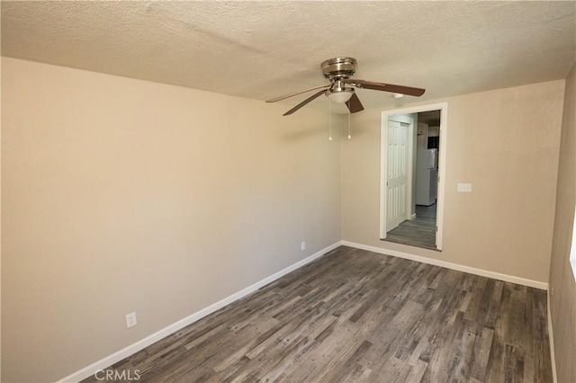 unfurnished room with ceiling fan, dark hardwood / wood-style floors, and a textured ceiling