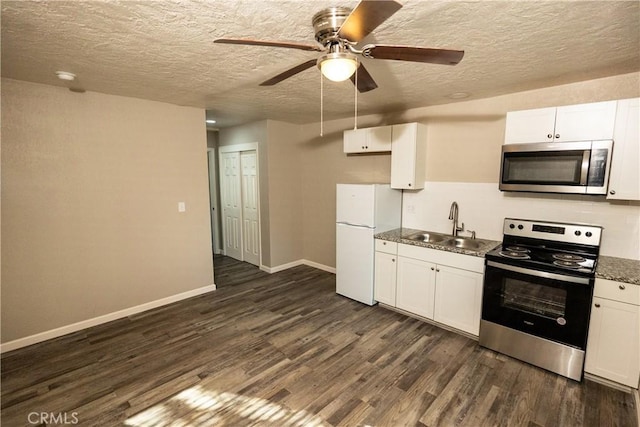 kitchen featuring sink, a textured ceiling, dark hardwood / wood-style floors, stainless steel appliances, and white cabinets