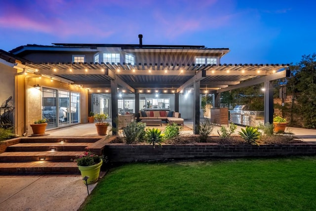 back house at dusk with a yard, outdoor lounge area, a pergola, and a patio