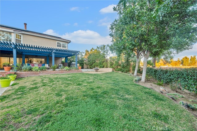 view of yard featuring a patio, an outdoor fire pit, and a pergola