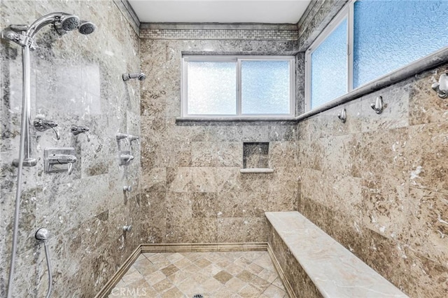 bathroom with tiled shower