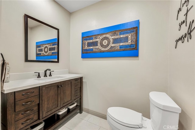 bathroom with vanity, tile patterned flooring, and toilet