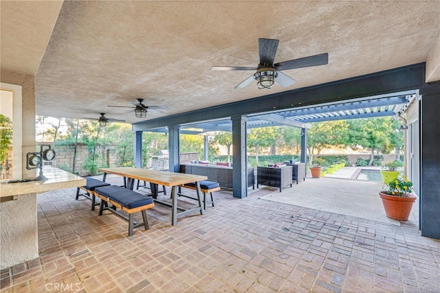 view of patio featuring ceiling fan and outdoor lounge area