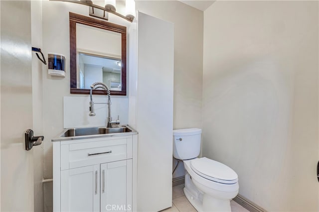 bathroom with vanity, tile patterned floors, and toilet