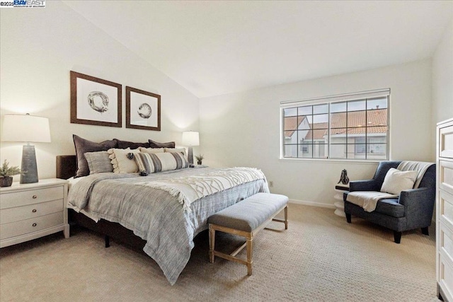 carpeted bedroom featuring vaulted ceiling