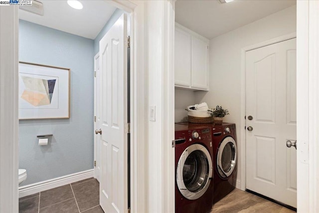 laundry area with cabinets, independent washer and dryer, and tile patterned floors