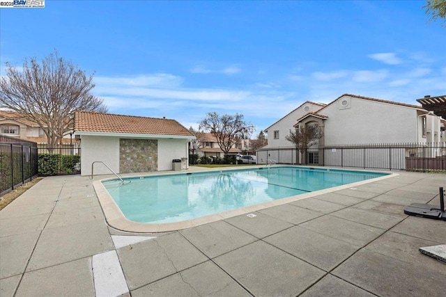 view of swimming pool featuring a patio area