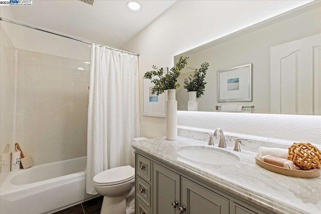 full bathroom featuring vanity, shower / bath combo, tile patterned floors, and toilet