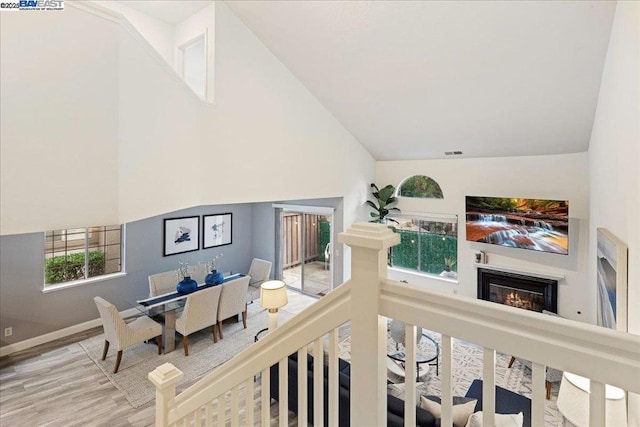 living room featuring hardwood / wood-style flooring and high vaulted ceiling