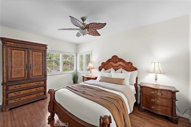 bedroom featuring ceiling fan and dark hardwood / wood-style flooring