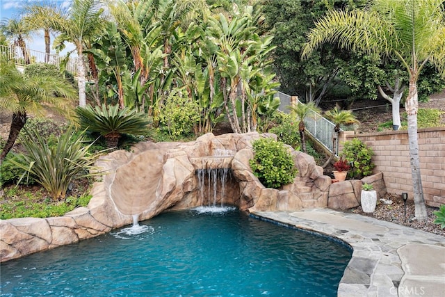 view of pool featuring pool water feature