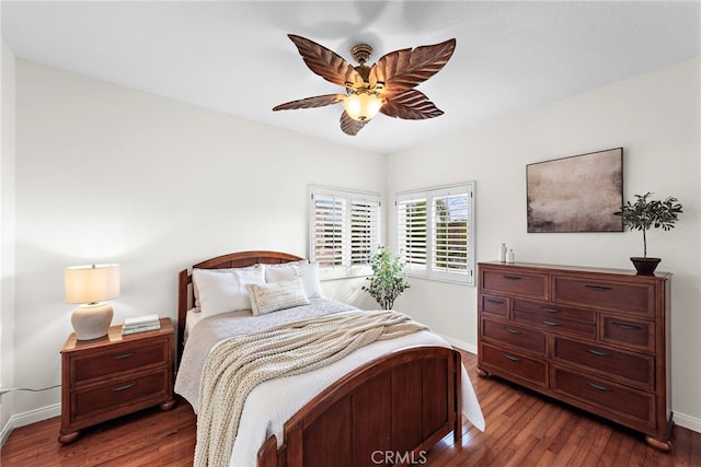 bedroom featuring dark hardwood / wood-style floors and ceiling fan