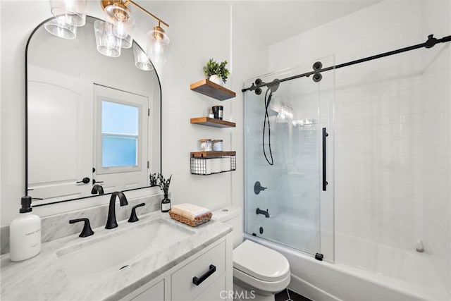 full bathroom featuring enclosed tub / shower combo, vanity, and toilet