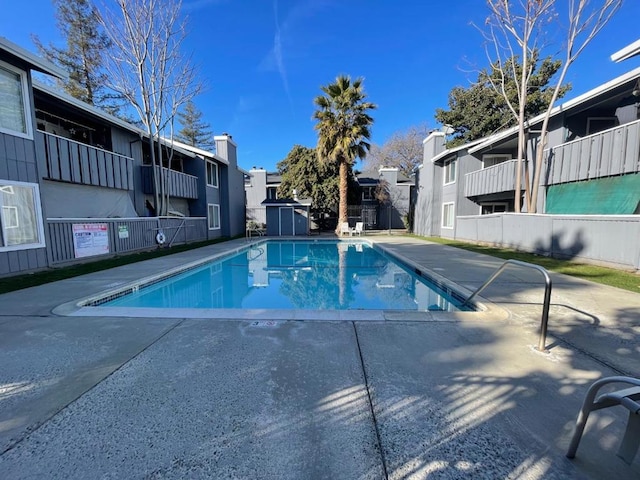 view of swimming pool with a patio area