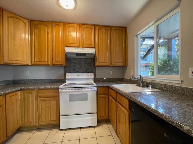 kitchen with sink, dark stone countertops, light tile patterned floors, black dishwasher, and electric stove