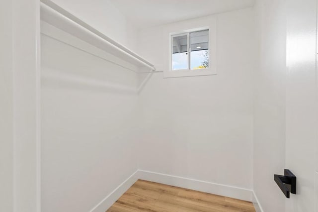 spacious closet featuring hardwood / wood-style flooring