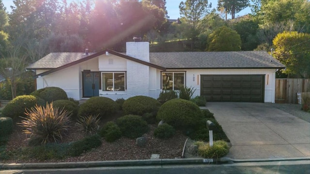 ranch-style house featuring a garage