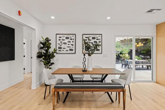 dining space featuring light hardwood / wood-style floors