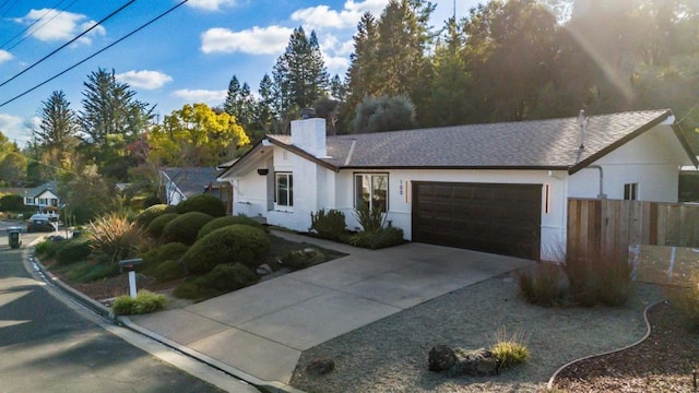 ranch-style home featuring a garage