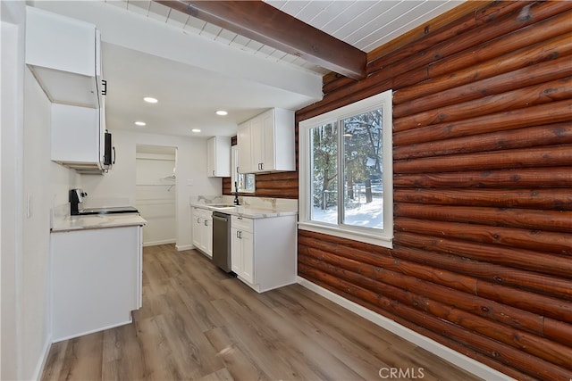 kitchen featuring beamed ceiling, white cabinetry, appliances with stainless steel finishes, and light hardwood / wood-style floors