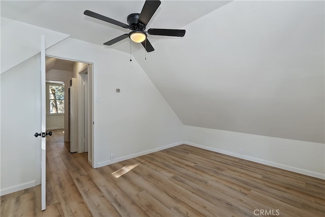 additional living space with lofted ceiling and light hardwood / wood-style floors