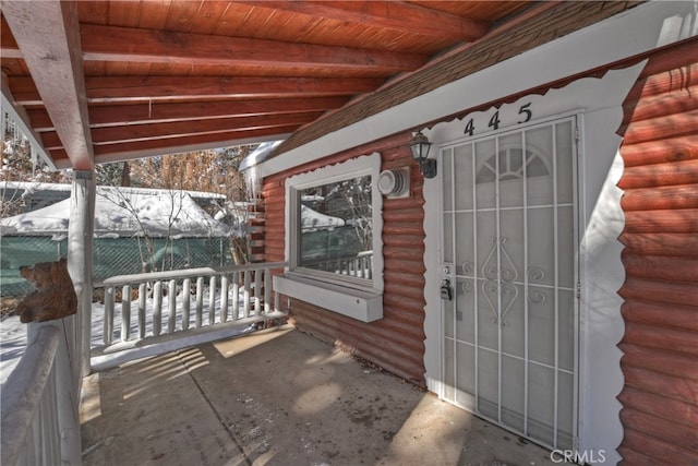 view of snow covered patio