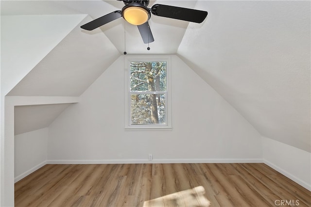 bonus room featuring ceiling fan, lofted ceiling, and light wood-type flooring