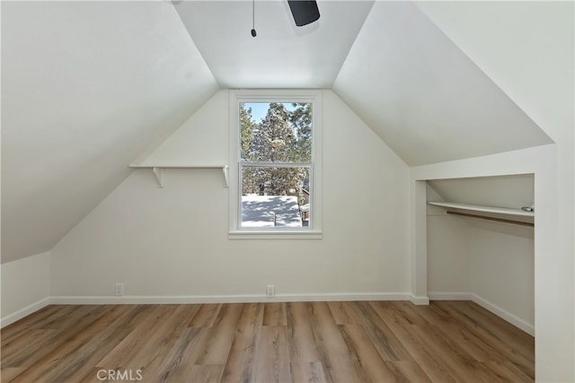 bonus room featuring hardwood / wood-style flooring and vaulted ceiling