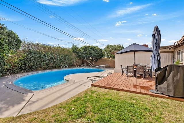 view of swimming pool with a gazebo, area for grilling, a yard, and a deck