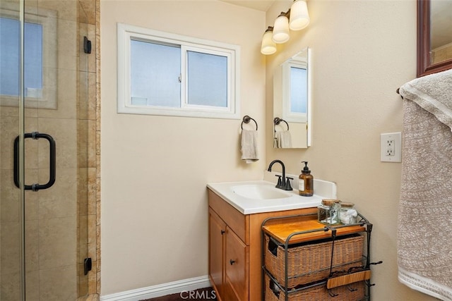 bathroom with walk in shower and vanity