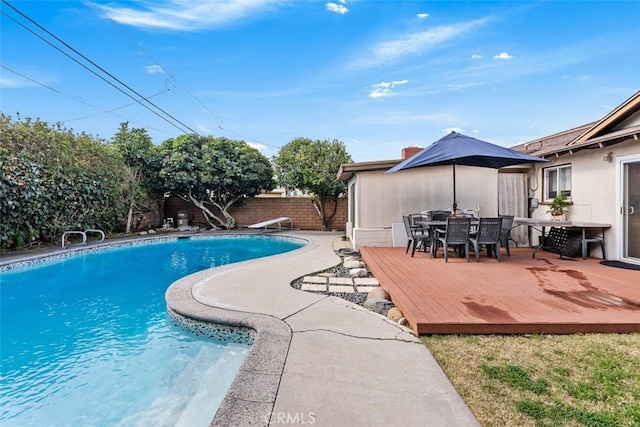 view of swimming pool featuring a diving board