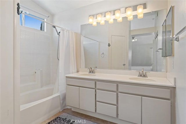 bathroom featuring vanity, lofted ceiling, and shower / bath combo with shower curtain