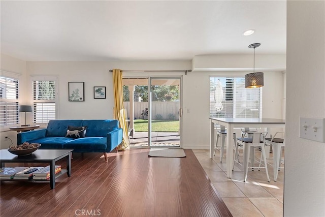 living room featuring hardwood / wood-style floors and a healthy amount of sunlight