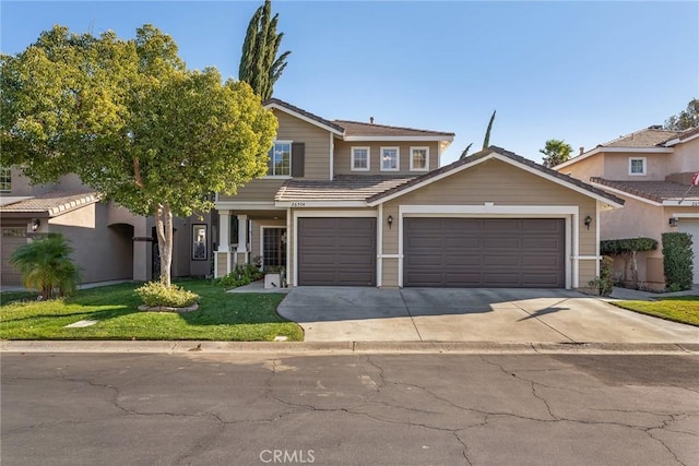 view of front of home with a garage and a front lawn