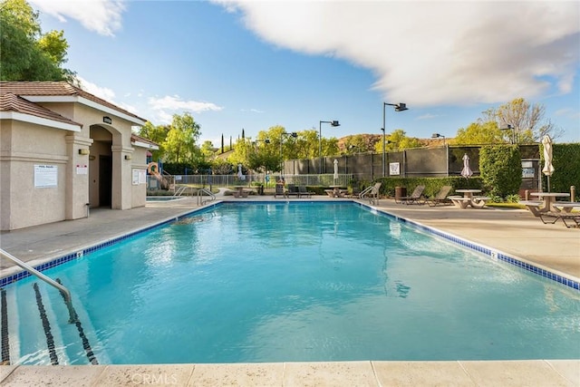 view of swimming pool featuring a patio